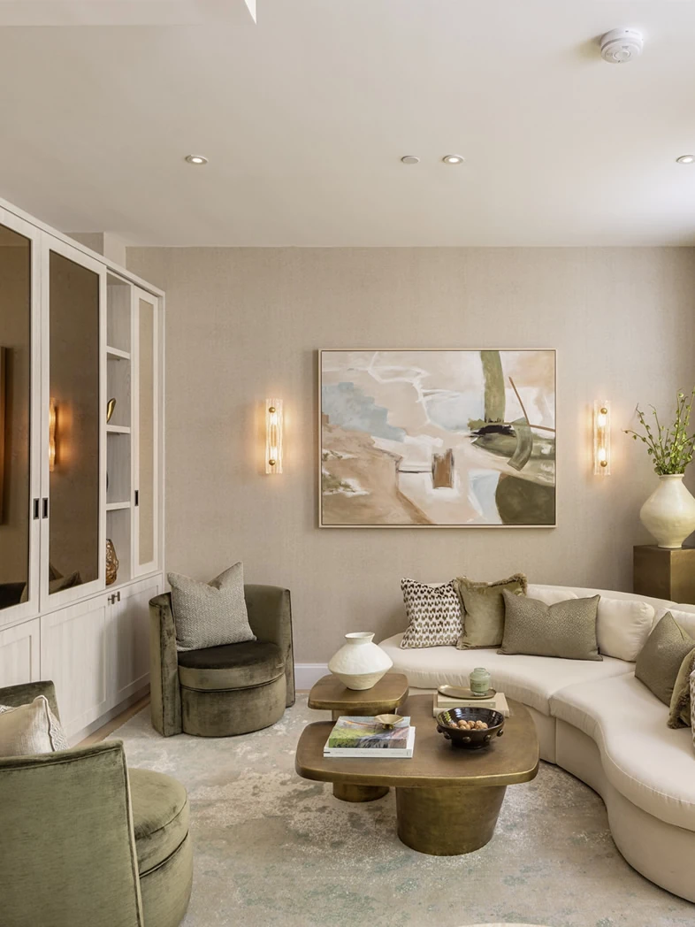 Bespoke glazed display cabinetry with integrated lighting in a living room